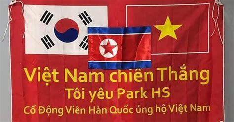 south koreans fans in vietnam s banner to support north korea football