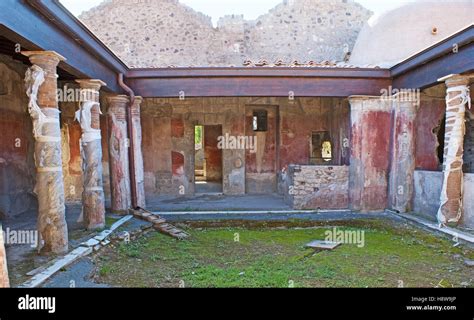 ancient courtyard   roman villa  painted walls  columns pompeii italy stock