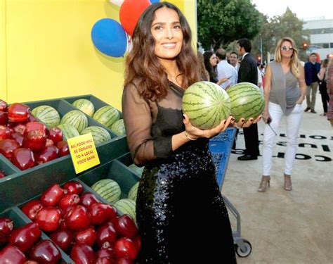 salma hayek gets cheeky with some watermelons in very busty top at
