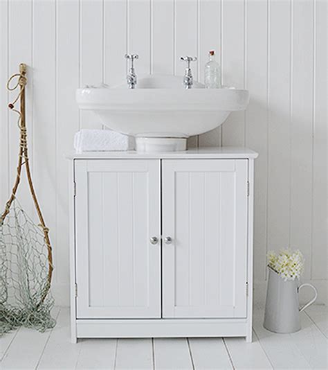 home treats white   sink cupboard space saving bathroom floor