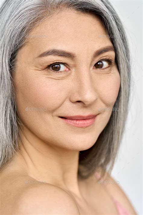 Closeup Of Asian Mature Mid Age Woman Of 50s Looking At Camera Stock