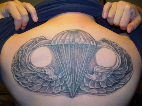 womans body  wings   parachute tattoo