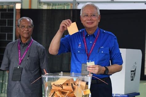 malaysia s scandal mired najib hit with travel ban after