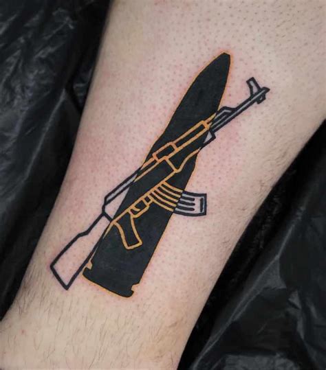 25 Of The Best Gun Tattoos Tattoo Insider Tattoo Ak47 Chicanas