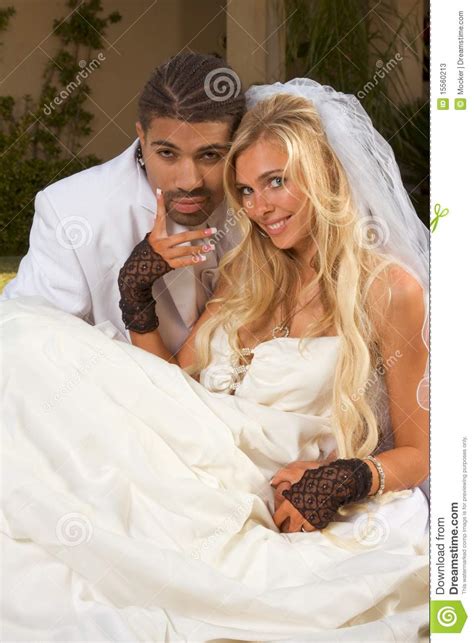 happy new wed interracial couple in wedding mood stock