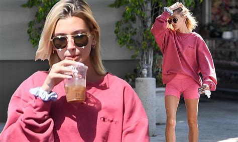 hailey baldwin parades long legs in hot pink bike shorts at pilates in