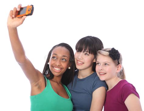 three teenage girl friends fun with camera selfie stock