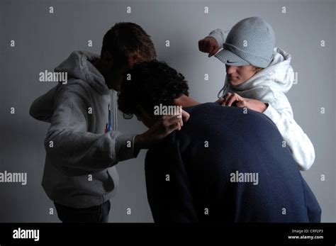 young men beating   young man stock photo alamy