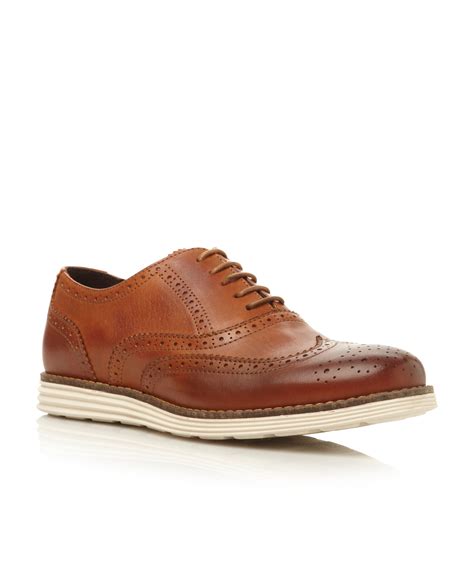 dune bayside lace up white wedge sole brogues in brown for