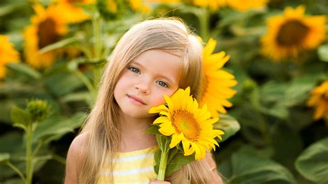 blue eyes little cute girl with blonde hair is wearing