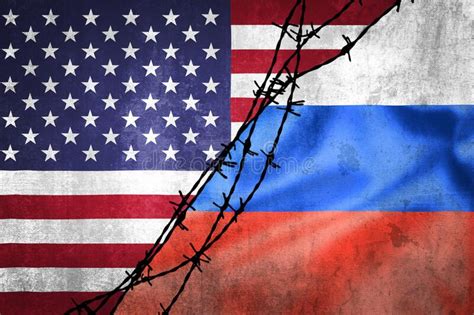 Grunge Flags Of Russian Federation And Usa Divided By Barb Wire