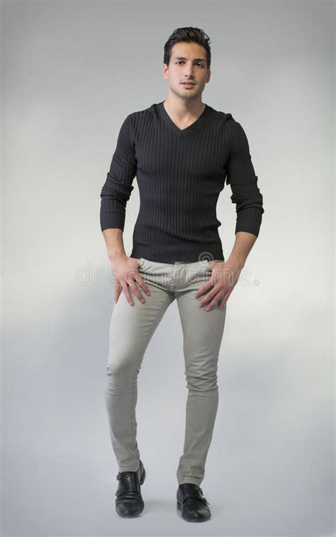 full body photo  young man standing  grey background stock photo image  model hair
