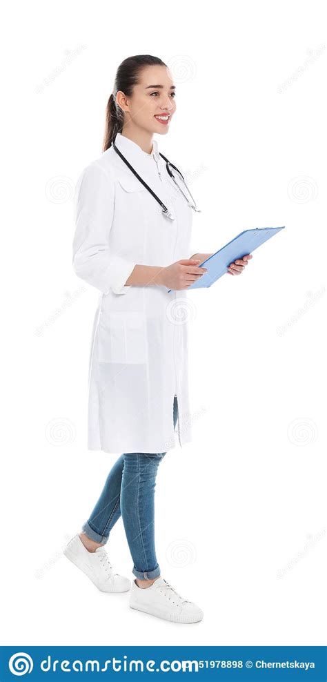 Full Length Portrait Of Medical Doctor With Clipboard And