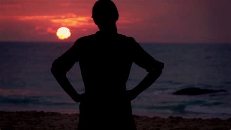 Silhouette Of Woman Looking On The Sunset On Exotic Beach Super Slow