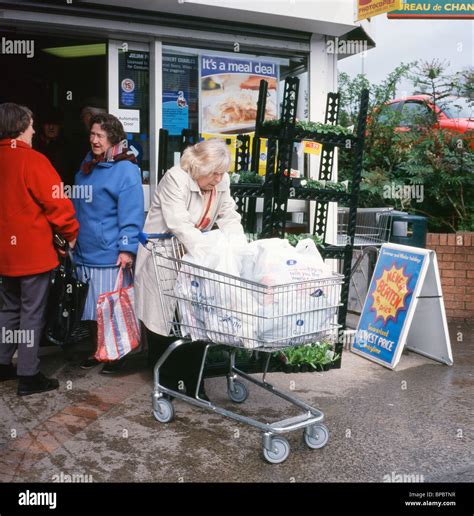 elderly woman   full shopping trolley    op stock