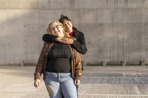 Latin Lesbian Couple Looking At Each Other With Affection Stock Image