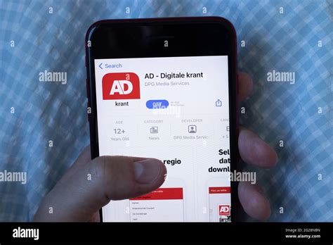 york usa  june  ad digitale krant mobile app logo  phone screen close  icon