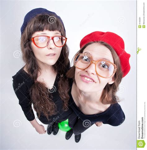 two cute girls wearing granny s glasses making funny faces stock image image 31459281