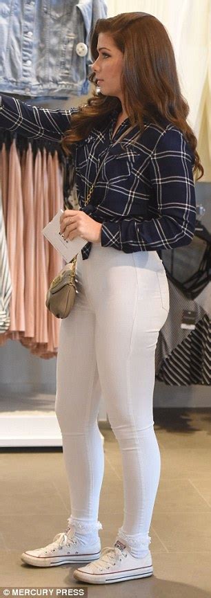nikki sanderson shows off her pert posterior in super skinny white