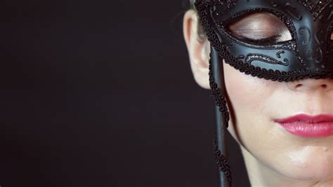 macro closeup of sexy woman wearing masquerade mask at