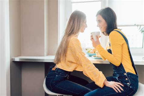 A Couple Of Lesbians Having Breakfast Enjoying The Morning Stock Image