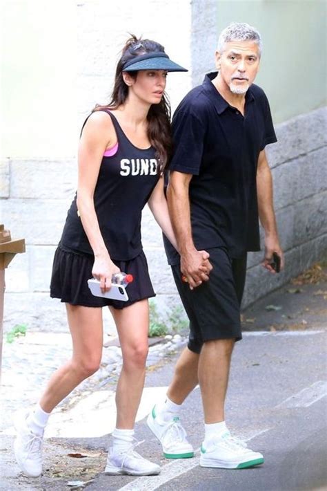 amal and george clooney hold hands on tennis court cute clooney