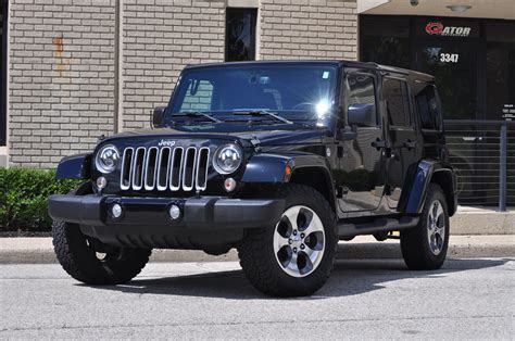 sold  jeep wrangler unlimited sahara  black  black leather seats  speed manual
