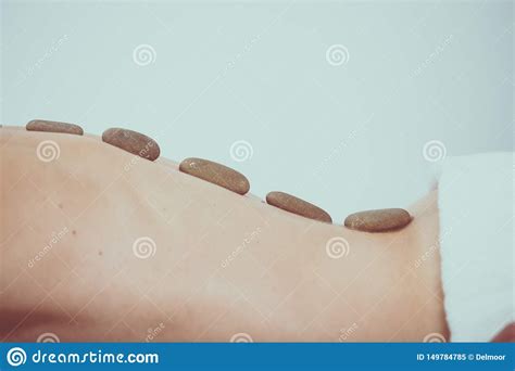 Hot Stone Massage Therapy At Beauty Center Stock Image