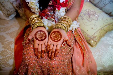 stunning indian bride shows off wedding day henna on hands