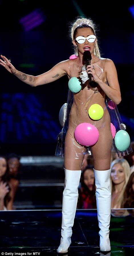 mtv vmas hostess miley cyrus causes a stir with 11 eyebrow raising outfits daily mail online