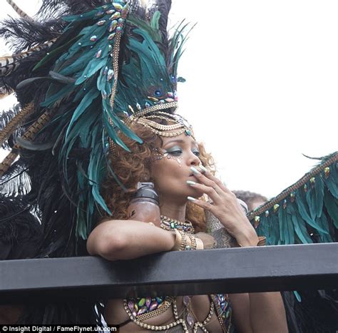 rihanna puts her figure 8 on full display in revealing costume at