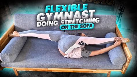 Home Contortion Flexible Gymnast Doing Stretching On The Sofa