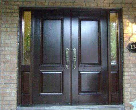 doors solid black wood double front entry doors  fiberglass   granite wall
