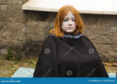 young girl  dead costume sits   park halloween concept editorial stock image image