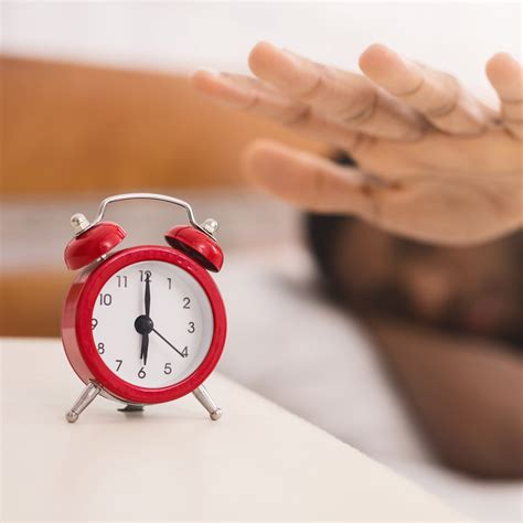 Hand Turning Off Alarm Clock Waking Up At Morning The Loop Blog