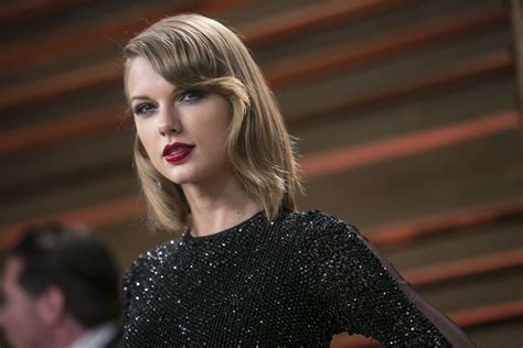 taylor swift explains those belly button bearing bikini shots and her