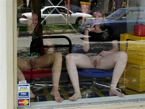 store front window girls flashing hardcore pictures