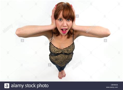 Teen Girl Covering Her Ears With Her Hands Photographed