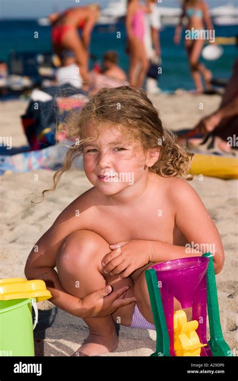girl amusing    beach saint tropez france stock