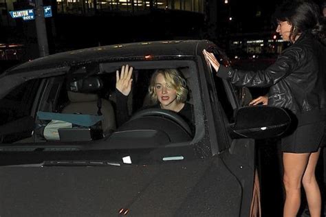 watch jennifer lawrence snap at paparazzi and almost hit