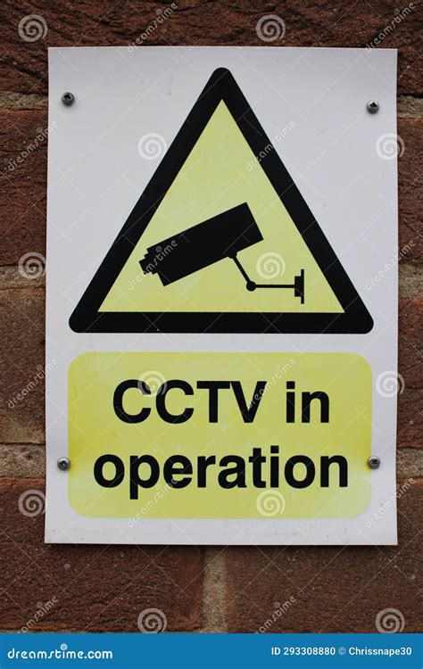 yellow  white sign cctv  operation stock photo image