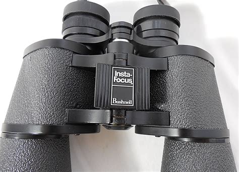 bushnell insta focus    binoculars property room