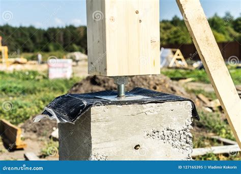 adjustable wooden post support construction   wooden house stock image image  concrete