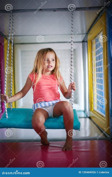 girl  playground girl  rocking   swing stock photo