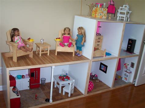 dolls  sitting  chairs  top   doll house   built   floor