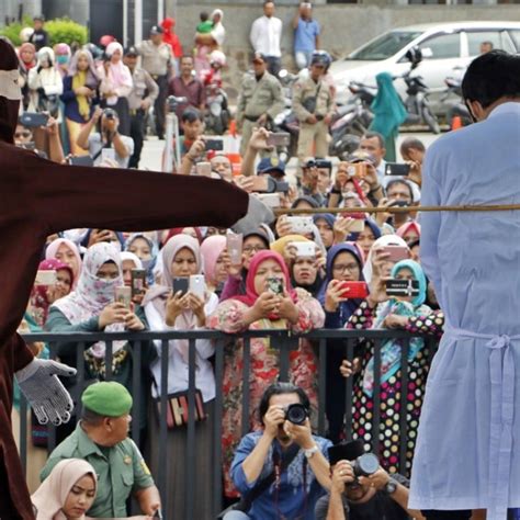 amorous couples and sex workers whipped publicly in indonesia s aceh