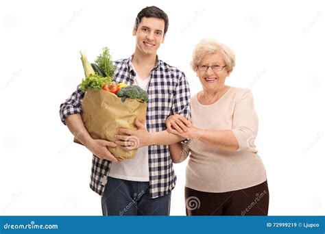 man helping  grandmother  groceries stock image image