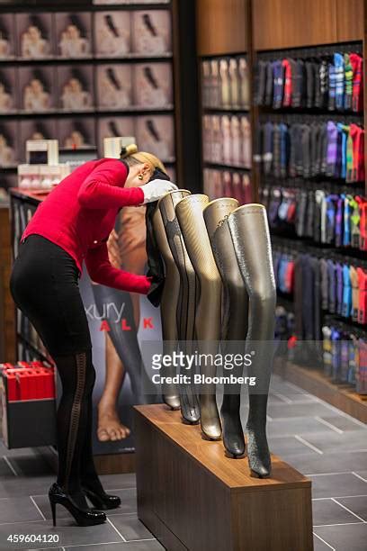 woman putting on stockings photos et images de collection getty images