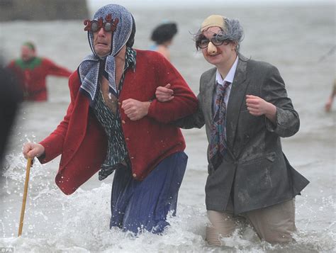 hundreds of hardy swimmers take to the ocean to mark new