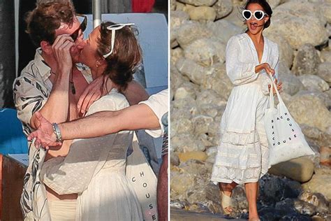 smitten alicia vikander wears white as she shares a kiss with fiance